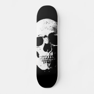 Skateboard aspecto retro de arte pop de cráneo