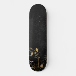 Skateboard de patrones decorativos en negro y oro