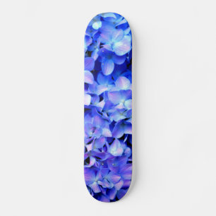 Skateboard Hirgueas tanzanitas, flores de magenta púrpura azu