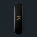 Skateboard Monograma de oro negro brillante elegante guión mo<br><div class="desc">Monograma de oro negro giratorio elegante y moderno</div>
