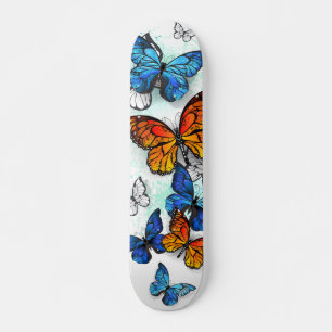 Skateboard Morfo y monarca de las mariposas voladoras