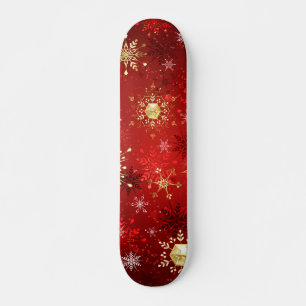 Skateboard Navidades Copos de nieve dorados con fondo rojo