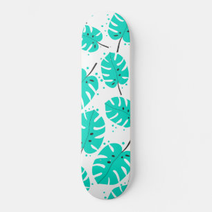 Skateboard Patinaje con hojas tropicales.