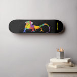 Skateboard Personalizado de color arcoiris Chameleon personal<br><div class="desc">Este skateboard está listo para ser personalizado con un nombre u otro texto personalizado. Presenta un ilustracion personalizado de colores vivos de un camaleón sobre un fondo negro con el texto en letras verdes de cal negrita.</div>