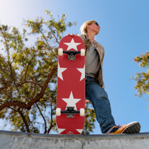 Skateboard Rojo con patines HAMbWG de estrellas blancas