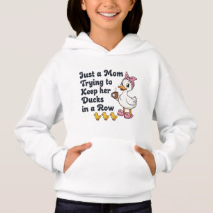 Solo una mamá tratando de mantener a sus patos en 
