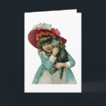 Sostener un gatito del navidad<br><div class="desc">El Victorian inspiró al chica que llevaba un capo rosado grande y que sostenía un gatito gris.</div>