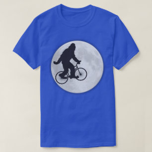 Squatch en bicicleta con camiseta de la luna