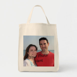 Su foto en una bolsa de asas del ultramarinos