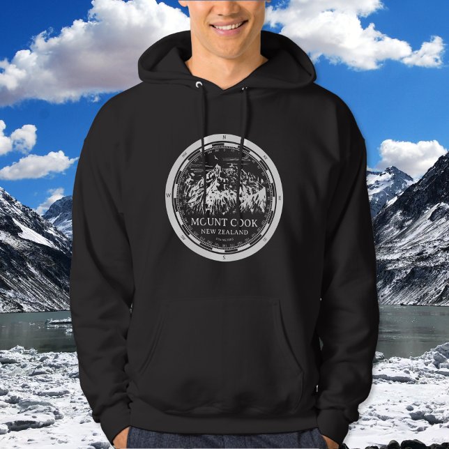 Sudadera Aoraki Monte Cook - Canterbury Nueva Zelanda (Mount Cook New Zealand Hoodie in Back with a white compass and mountain illustration)