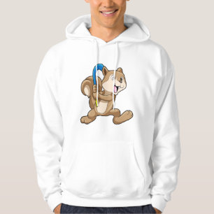 Sudadera ardilla en el hockey de campo con palo de hockey