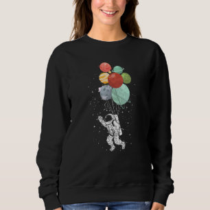Sudadera Astronauta sosteniendo globos planetarios espacio 