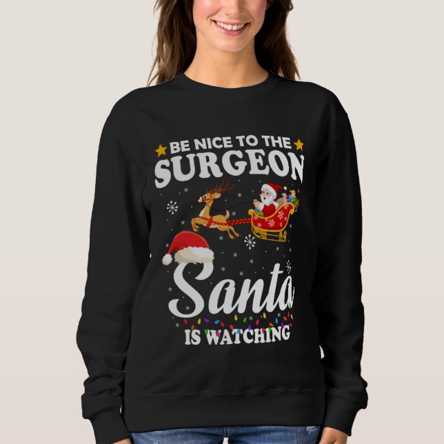 Sudadera Be Nice To The Surgeon Santa Watching Xmas (Anverso)