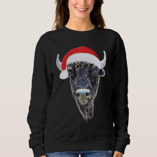 Sudadera Búfalo del navidad que lleva un gorra festivo de