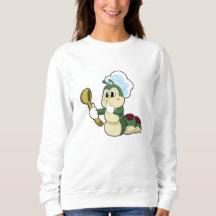 Sudadera Caterpillar como chef con cuchara de madera