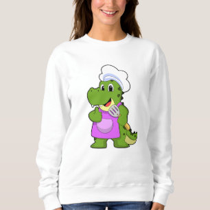Sudadera Cocodrilo como cocinero con espátula