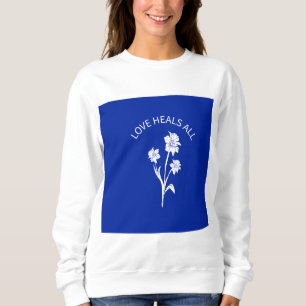 Sudadera con acento azul real "El amor cura todo"