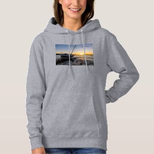 Sudadera con capucha puesta del sol en el barco de