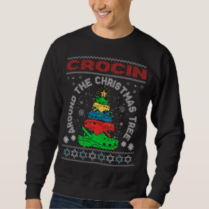 Sudadera Crocin alrededor del árbol de Navidad