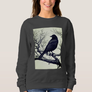 Sudadera Crow encarchado en ramas de invierno desnudas