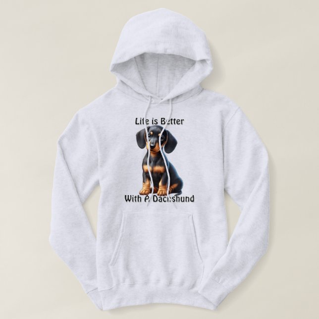 Sudadera Dachshund Puppy Sentado y mirando con indiferencia (Diseño del anverso)