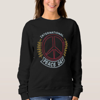 Sudadera Día Internacional de la Paz Signo de Paz Neon para