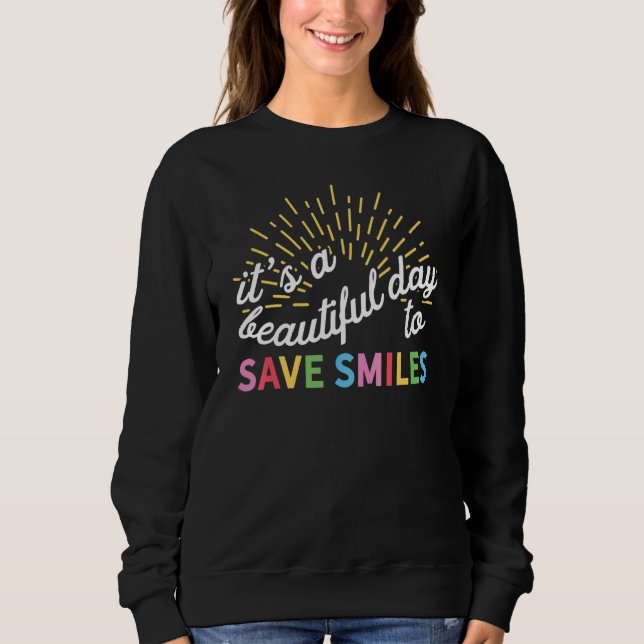 Sudadera Es un bello día para salvar sonrisas dentarias (Anverso)