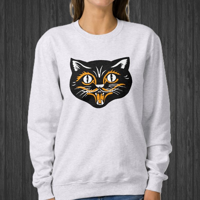 Sudadera Feliz Halloween negro cara de gato con blanco Nara (Happy Black cat face for Halloween with orange and white accents on sweatshirt.)