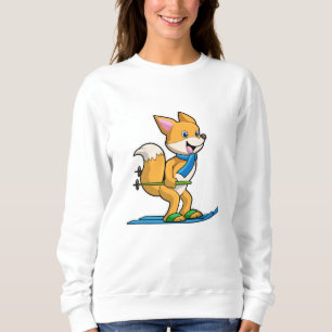 Sudadera Fox como esquiador con bastones de esquí y esquí