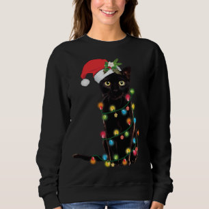 Sudadera Gato negro de Santa enredado en luz de árbol de Na