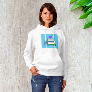 Sudadera Gema Púrpura en Pila de Libros con Escalera