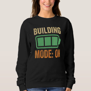 Sudadera Modo de construcción con diseño de batería