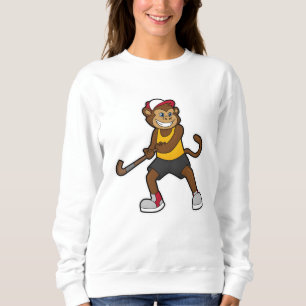 Sudadera Mono al hockey con bastón de hockey