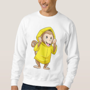 Sudadera Mono en la lluvia con el abrigo