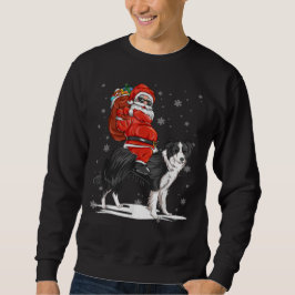 Sudadera navidades de colonias fronterizas Dog Riding Santa