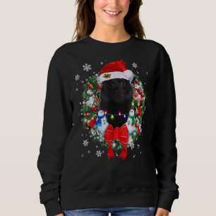 Sudadera Navidades de Schipperke con decoración de guirnald