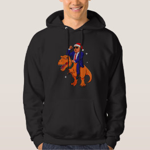 Sudadera Navidades divertidos Trump montando dinosaurio T-R