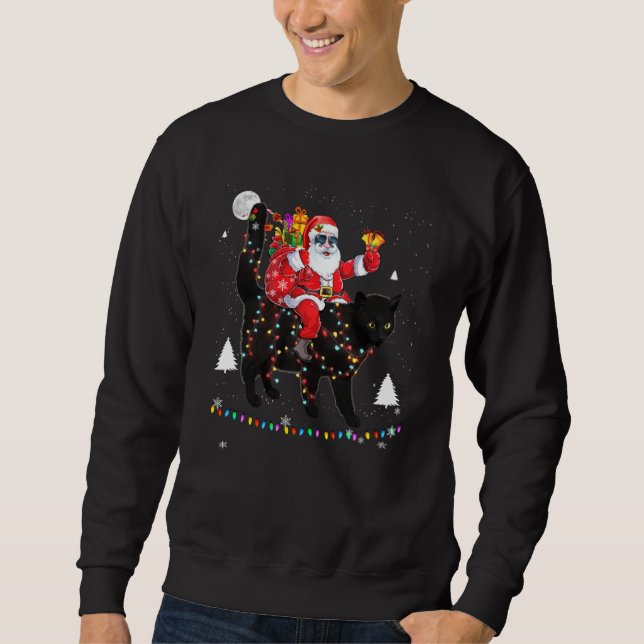 Sudadera Navidades Santa Claus montando un gato negro encie (Anverso)