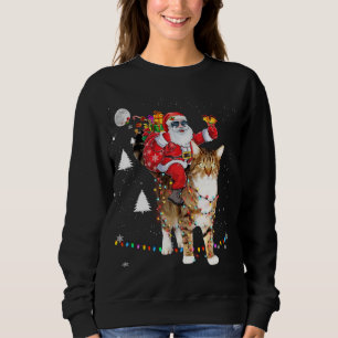 Sudadera Navidades Santa Claus montando un gato sobre tigre