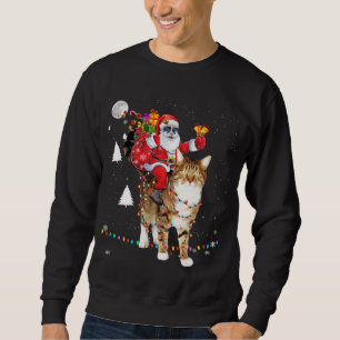 Sudadera Navidades Santa Claus montando un gato sobre tigre