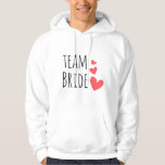 Sudadera Novia de equipo<br><div class="desc">Impresionante diseño con la cita "Novia en equipo" y tres corazones rojos. Una idea estupenda y divertida para una soltera o para la fiesta de bodas.</div>