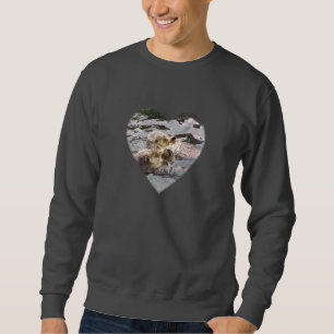Sudadera Nutrias de mar que llevan a cabo las manos
