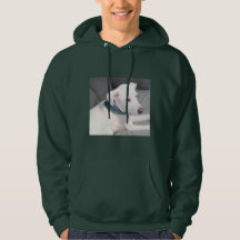 Perro de cachorro blanco lindo con bufanda verde