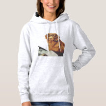 Perro sentado frente a una revista