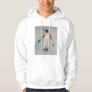 Sudadera Pingüino caminando en la playa
