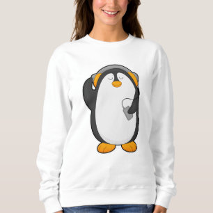 Sudadera Pingüino y teléfono móvil con auriculares