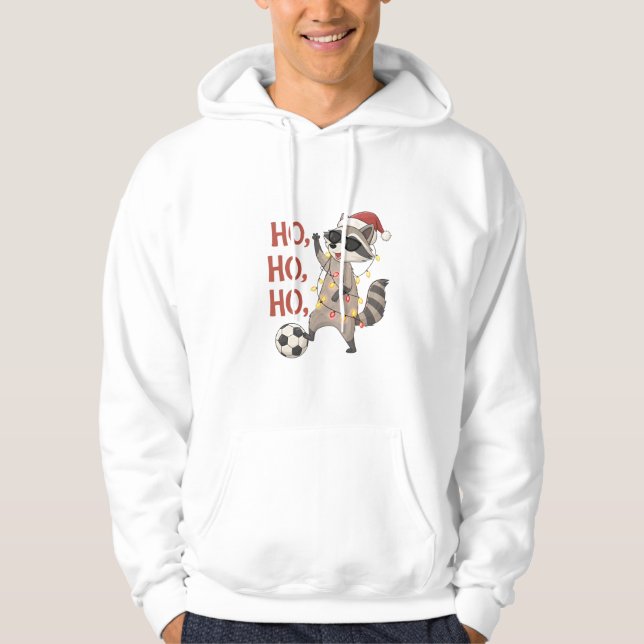 Sudadera Raccoon with lights and Christmas hat playing socc (Anverso)