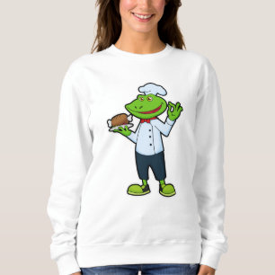 Sudadera Rana como cocinera con plato de servicio y pollo
