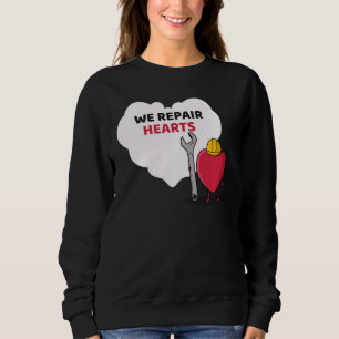 Sudadera Reparamos corazones Idea del Equipo de Atención Ca