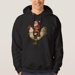 Sudadera Santa montando un gallo
